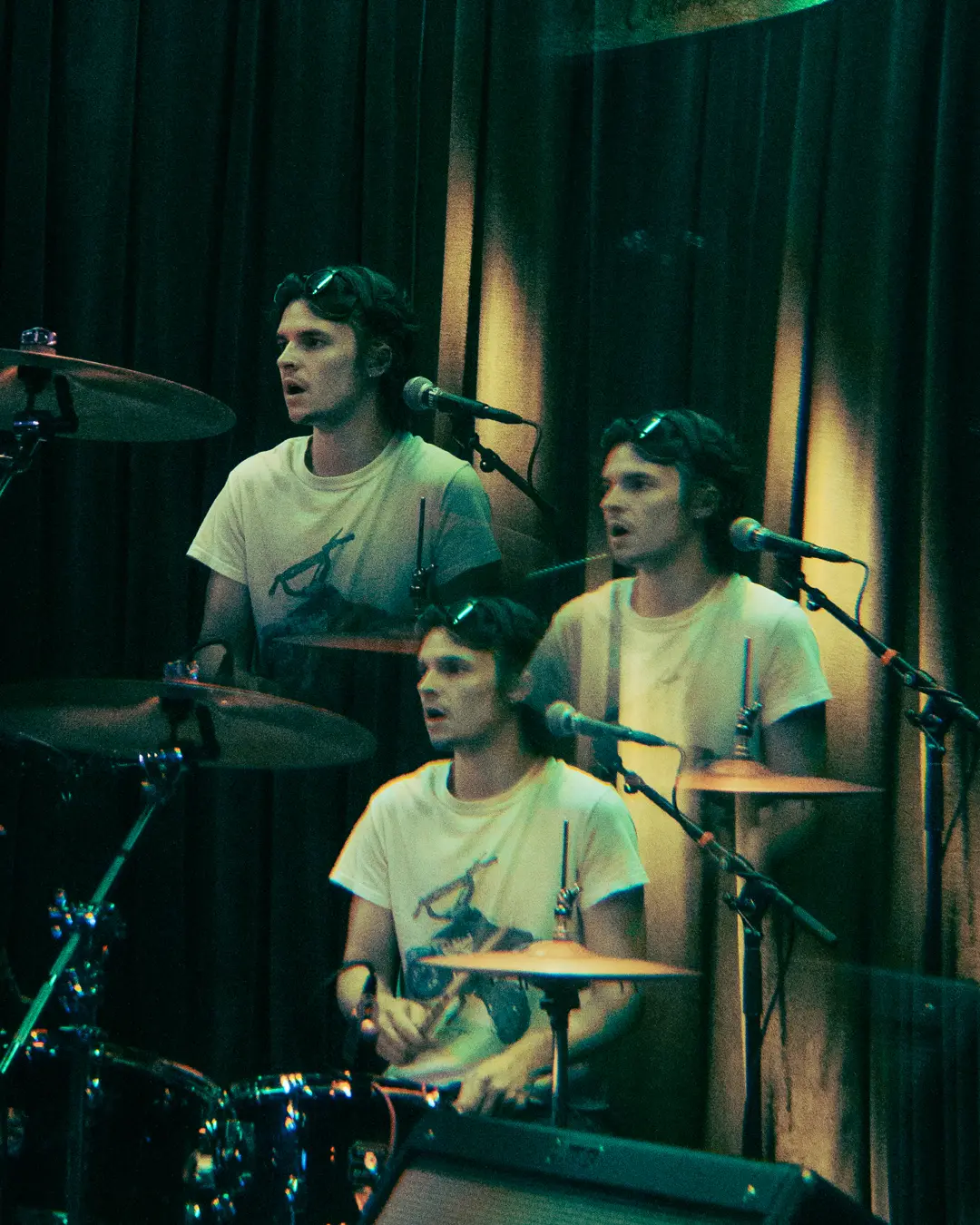 Mason Wiley in triple exposure at the kit, a microphone at every face.
