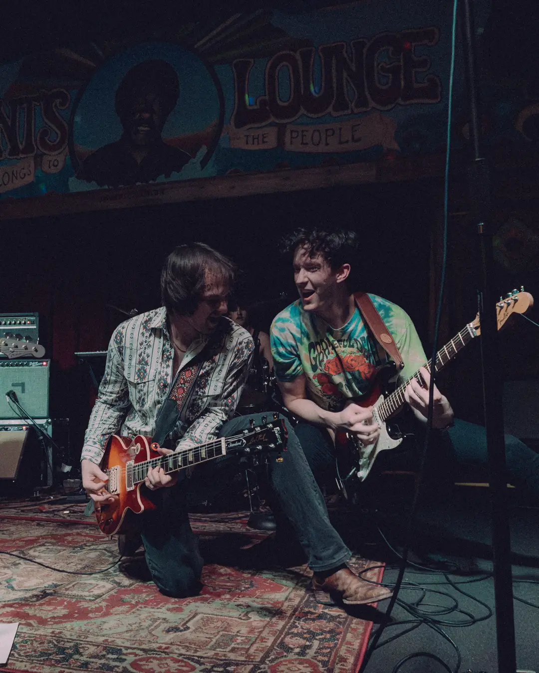 Two guitars down on the boards together at Grant's Lounge.